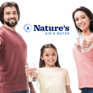 Smiling family with glasses of clean water with the Nature's Air & Water logo behind them.
